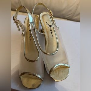 Low heeled, gold open toed, strapping shoe.  Size 7 1/2.